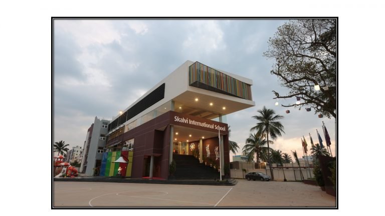 Indian parents visiting a modern school campus with their child, interacting with a school counsellor while exploring classrooms and learning facilities.
